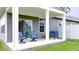 Inviting covered patio with comfortable seating, perfect for relaxing and entertaining at 17303 Lillian St, Westfield, IN 46074