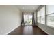 Bright sun room with hardwood floors and glass sliding doors leading to an outdoor patio area at 17303 Lillian St, Westfield, IN 46074