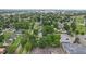 Aerial view of homes surrounded by mature trees in a quiet neighborhood, with easy access to local amenities at 1739 Caldwell Pl, Columbus, IN 47201