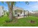 Cozy backyard with covered patio featuring outdoor seating and grill at 1739 Caldwell Pl, Columbus, IN 47201