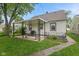 Outdoor space with covered patio and backyard landscaping at 1739 Caldwell Pl, Columbus, IN 47201