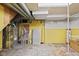 Basement utility area, including furnace and storage shelves at 1739 Caldwell Pl, Columbus, IN 47201