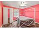 Light filled bedroom featuring a white four-poster bed and a sliding door closet at 1739 Caldwell Pl, Columbus, IN 47201