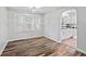 Sunny dining area showcasing wood floors and easy access to a well-lit kitchen at 1739 Caldwell Pl, Columbus, IN 47201