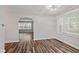 Inviting living room featuring wood floors, neutral walls, and abundant natural light through bright windows at 1739 Caldwell Pl, Columbus, IN 47201