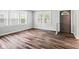 Inviting living room featuring wood flooring, abundant natural light, and neutral paint at 1739 Caldwell Pl, Columbus, IN 47201