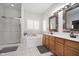 Bright bathroom with a tub, shower, and double vanity, offering a relaxing space at 18432 Oriental Oak Ct, Noblesville, IN 46062