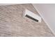 Mini split system mounted on a white brick wall at 18432 Oriental Oak Ct, Noblesville, IN 46062