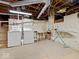 Basement featuring laundry area with washer, dryer and a storage shelf at 228 W Washington St, Shelbyville, IN 46176