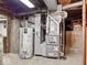 Basement mechanicals featuring water heater, furnace and ductwork at 228 W Washington St, Shelbyville, IN 46176