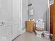 Small bathroom features a classic toilet, single sink vanity, and compact design for essential comfort at 228 W Washington St, Shelbyville, IN 46176