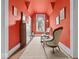 Red bedroom with vintage-style furnishings and natural light at 228 W Washington St, Shelbyville, IN 46176