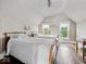 Bedroom featuring hardwood floors and natural light from two windows at 228 W Washington St, Shelbyville, IN 46176