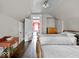 Bedroom showcasing hardwood floors and a connecting doorway at 228 W Washington St, Shelbyville, IN 46176