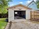 Single-car detached garage with a concrete block foundation, offering secure parking and additional storage space at 228 W Washington St, Shelbyville, IN 46176