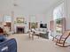 This living room offers carpeted floors, neutral walls, and a fireplace providing a warm and inviting atmosphere at 228 W Washington St, Shelbyville, IN 46176