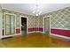 Open dining area with built-in cabinet and easy access to other rooms at 23 S Downey Ave, Indianapolis, IN 46219