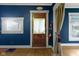 Charming entryway with wood floors, blue walls, and vintage details at 23 S Downey Ave, Indianapolis, IN 46219