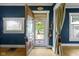Entryway with open front door that highlights natural light and garden view at 23 S Downey Ave, Indianapolis, IN 46219