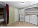 Room features a curtain, a closet, and washer and dryer at 23 S Downey Ave, Indianapolis, IN 46219