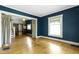 This living room features a classic design with hardwood floors and ample natural light at 23 S Downey Ave, Indianapolis, IN 46219
