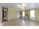 Spacious living room with a wood-burning fireplace, large windows, and unique architectural features at 23 S Downey Ave, Indianapolis, IN 46219