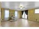 Bright room with a faux fireplace, natural lighting, and views of the yard at 23 S Downey Ave, Indianapolis, IN 46219