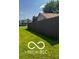 Exterior shot of backyard with grass and a wood fence at 241 Deborah Ln, Whiteland, IN 46184
