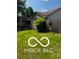 Exterior shot of the backyard featuring grass, a shed and a wooden fence at 241 Deborah Ln, Whiteland, IN 46184
