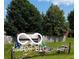 Exterior view of backyard shed with a wooden fence, and a green yard at 241 Deborah Ln, Whiteland, IN 46184