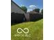 Fenced backyard with green lawn at 241 Deborah Ln, Whiteland, IN 46184