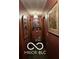 Hallway view with maroon walls, artwork, and door frames at 241 Deborah Ln, Whiteland, IN 46184