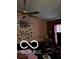 Living room area with a ceiling fan and a Gathering photo display at 241 Deborah Ln, Whiteland, IN 46184