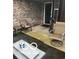 Covered patio with chairs, side table and door at 241 Deborah Ln, Whiteland, IN 46184