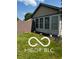 Back of home with a sunroom featuring multiple sliding windows at 241 Deborah Ln, Whiteland, IN 46184