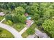 Beautiful aerial view of a home nestled in a lush, wooded neighborhood with a swimming pool and mature trees at 259 Glenbrook Ln, Avon, IN 46123