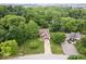 Picturesque aerial view of a beautiful home surrounded by mature trees and manicured landscaping at 259 Glenbrook Ln, Avon, IN 46123