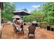 Inviting backyard deck with a built-in bar, outdoor seating, and lush landscaping, ideal for entertaining at 259 Glenbrook Ln, Avon, IN 46123