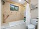 Stylish bathroom features a soaking tub with custom tile surround, providing a relaxing and luxurious experience at 259 Glenbrook Ln, Avon, IN 46123