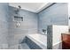 Modern bathroom features a tiled shower, tub, and glass details for a stylish design at 259 Glenbrook Ln, Avon, IN 46123