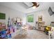 A brightly lit playroom with carpet, ceiling fan, natural light, and plenty of room to play at 259 Glenbrook Ln, Avon, IN 46123