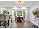 Cozy dining area with large windows and views of the backyard deck at 259 Glenbrook Ln, Avon, IN 46123
