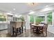 Cozy dining area with large windows and views of the backyard deck at 259 Glenbrook Ln, Avon, IN 46123