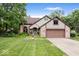 Charming two-story brick home with a well-manicured lawn and an attached two-car garage at 259 Glenbrook Ln, Avon, IN 46123