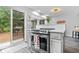 Bright eat-in kitchen with stainless steel stove and sliding doors to deck at 259 Glenbrook Ln, Avon, IN 46123