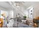 Open-concept living area with stairs and luxury vinyl plank flooring at 259 Glenbrook Ln, Avon, IN 46123