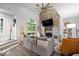 Inviting living room with a brick fireplace, vaulted ceilings, and an open layout at 259 Glenbrook Ln, Avon, IN 46123