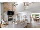 Inviting living room with a brick fireplace, vaulted ceilings, and an open layout at 259 Glenbrook Ln, Avon, IN 46123
