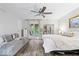 The spacious main bedroom features a ceiling fan and access to the porch at 259 Glenbrook Ln, Avon, IN 46123