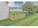 A fenced backyard backs up to a picturesque lake, enhancing privacy and offering scenic views at 2615 Pumpkin Patch Ln, Indianapolis, IN 46229
